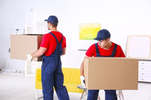 Professional flat removals team handling apartment furniture