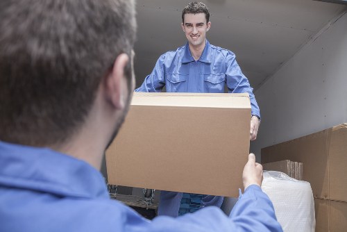 Packed moving boxes ready for flat removals in S