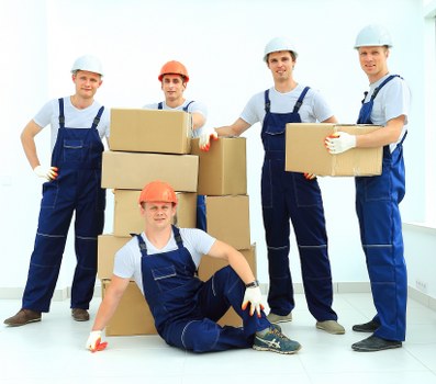 Careful packing preparation for student removals in S with labeled boxes and essentials