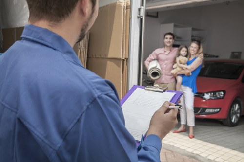 Professional movers loading items for same day removals in S