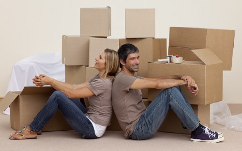House removalists carefully handling fragile household items during a move