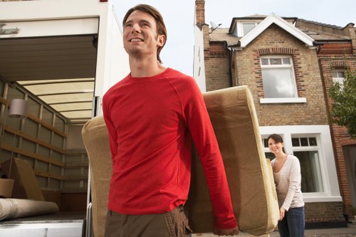 Professional man with van helping with moving items