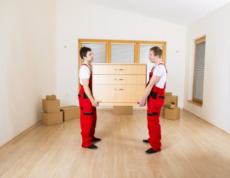 Moving team handling office furniture removals in S