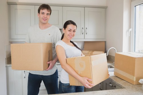Expert movers carefully packing fragile household items